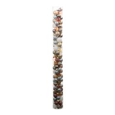 a tall glass tube filled with lots of different colored beads