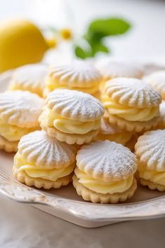 lemon meringue cookies with powdered sugar on a plate