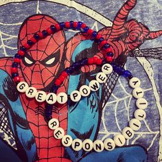 a spiderman beaded bracelet with words on it