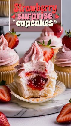 strawberry surprise cupcakes on a plate with strawberries