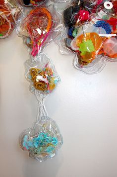 there are many lollipops in the clear bags on the table and one is filled with candy