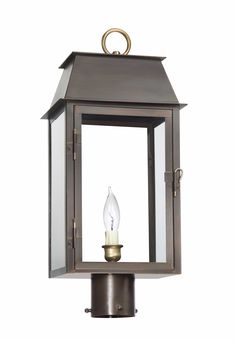 an outdoor light with a candle on it's side and the top half open