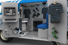 an image of a man's room in the back of a van with clothes on wheels