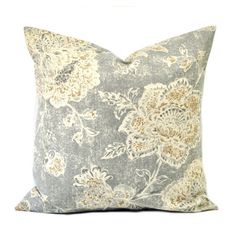 a blue and white pillow with flowers on it