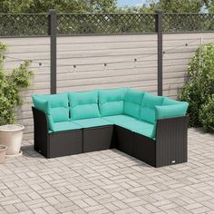 an outdoor patio furniture set with blue cushions