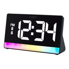 the alarm clock is black with multicolored leds and white numbers on it