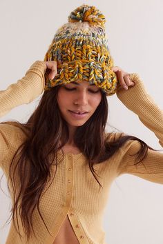 Essential for cold-weather accessorizing, this beanie features a chunky knit fabrication with a folded cuff and oversized pom. **Features:** Chunky knit fabrication, folded cuff, oversized pom detail, slouchy beanie style **Why We ❤ It:** This beanie adds a cozy touch to every look. | Tide Knit Pom Beanie at Free People in Gold Combo Beanie Style, Knitted Beanie, Slouchy Beanie, Pom Beanie, Chunky Knit, Hat Fashion, Boho Outfits, Cold Weather, Color Coding