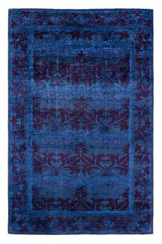 a blue and red rug with an intricate design on the bottom, in front of a white background