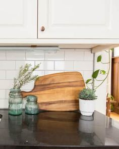 the kitchen counter is clean and ready to be used as a place for cutting vegetables