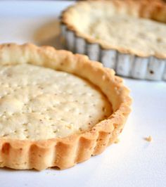 two pies sitting on top of a white counter