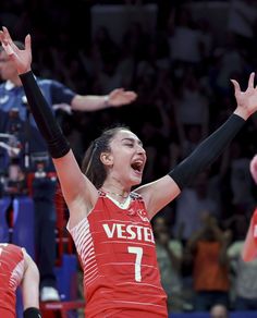 a female basketball player is celebrating her team's victory