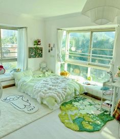 a bedroom with lots of windows and white furniture