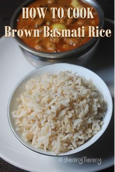 a white bowl filled with brown basmat rice next to a pot of red curry