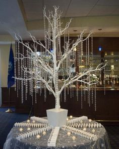 a white tree with lots of lights on it