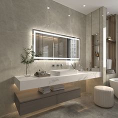 a bathroom with two sinks and a large mirror above the bathtub is lit by recessed lights