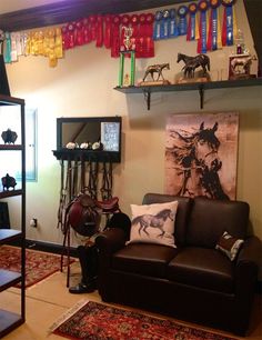 a living room filled with lots of furniture and decor on top of it's shelves