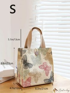 an image of a butterfly print bag on a table with measurements for the size and width