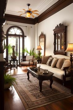 a living room filled with furniture and a large rug on top of a hard wood floor