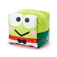 a green and white lunch bag with eyes, nose and mouth drawn on the side