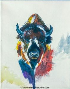 a painting of a bison with multicolored paint on it's face and horns