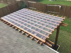 a wooden structure sitting on top of a roof