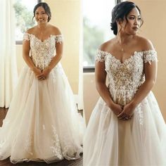 a woman in a wedding dress standing next to a window with her hands on her hips