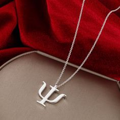 "My Psi symbol pendant is cast from sterling silver and makes a great statement piece for those interested in the field of Psychology 🎁 Comes with a complimentary adjustable Sterling Silver 1mm link chain that matches the finish of the pendant. It's my gift to you as a big thank you for supporting my handmade shop! ✦ ABOUT Ψ ✦ This ancient Greek symbol, Ψ, or Psi, is the twenty-third letter in the Greek alphabet. In ancient Greek, this symbol meant \"butterfly\" and was used to describe the sou Psychology Jewelry, Psychology Symbol, Psychology Wallpaper, Ancient Greek Symbols, Greek Symbol, Science Jewelry, Greek Alphabet, Science Themes, Themed Jewelry