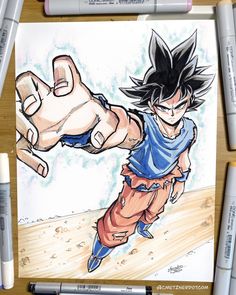 a drawing of gohan from dragon ball is shown on a piece of paper with markers