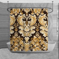 the shower curtain is decorated with gold and brown floral designs on a black, beige, and white background