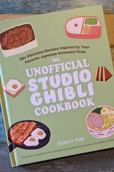 the official studio cookbook on a wooden table