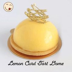 a lemon curd tart dome on a plate