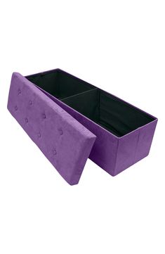 a large purple planter sitting on top of a white floor