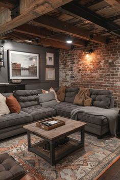 a living room filled with furniture and a brick wall