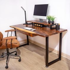 an office desk with a computer and chair