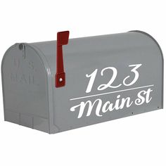 a gray mailbox with the number 1235 on it's front and side