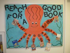 a bulletin board with an orange octopus on it's face and words reading reach for a good book