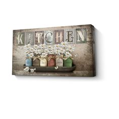 a wooden sign that says kitchen with daisies in vases and jars on it