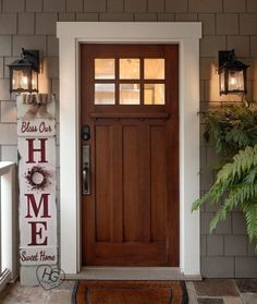 a welcome sign on the front door of a house