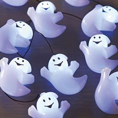 some white plastic ghost lights on a table