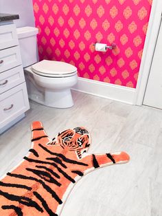 a bathroom with a tiger rug on the floor