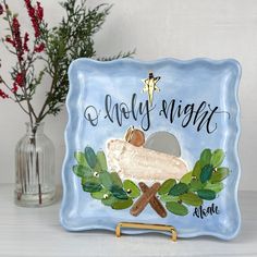 a blue glass plate with the words holly night on it