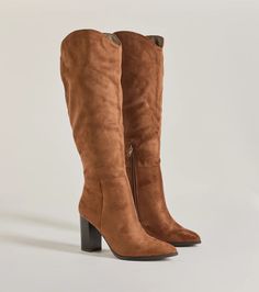 Chic and of the moment, these faux suede boots have a knee-high design perfect for pairing with mini and midi dresses. They feature a pointed toe, a partial inner zipper closure, and a sturdy stacked block heel.Fit & Features3.5" Stacked block heel, 8" leg opening, 11" shaft heightFaux microsuede materialKnee-highPointed toePartial inner zipper closureRuns true to size White Holiday Dress, Sequin Holiday Dress, Homecoming Shoes, Backless Dress Short, Red Holiday Dress, Lace Dress Styles, Homecoming Outfits, Faux Suede Boots, Formal Dresses With Sleeves