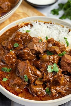 a white bowl filled with meat and rice