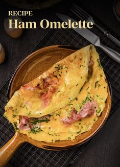 an omelette with ham is on a plate