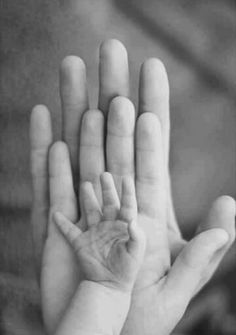 a black and white photo of a person's hand