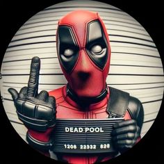 a deadpool man holding a sign with the word dead pool in front of him