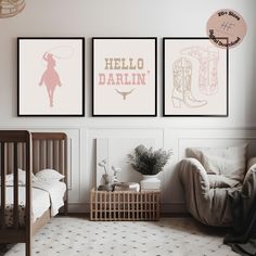 a baby's room with three posters on the wall