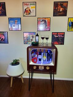 an old fashioned tv sitting on top of a wooden table