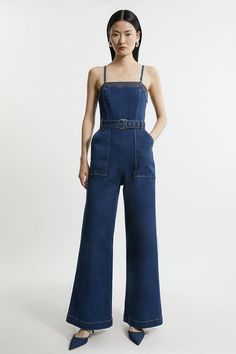 Feel Elevated In Our Jumpsuit, Made In Classic Denim, Featuring A Wide Leg Silhouette, And A Fitted Bodice With A Bandeau Neckline. The Denim Fabric Creates A More Relaxed Style, So Style This Piece With Sandals, Loafers, Or Heels For A Look That Goes Seamlessly From Day To Night. Stretch Denim Bandeau Belted Wide Leg Jumpsuit High Quality, Stretchy Denim Fabric Flattering Fit And Flare Silhouette Bandeau Neckline Belted Waistline Comfortable, Wide Leg Silhouette Deep Pocket Accents Removable Sp Bride Jumpsuit, Petite Wedding Guest Dresses, Plus Size Workwear, Summer Bridesmaid Dresses, Italy Outfits, Outfits Petite, Wedding Guest Dress Summer, Denim Flares, Denim Jumpsuit