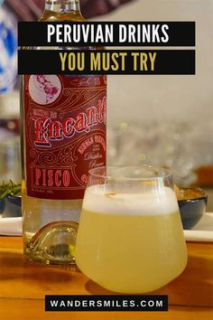 a bottle of beer sitting next to a glass filled with liquid